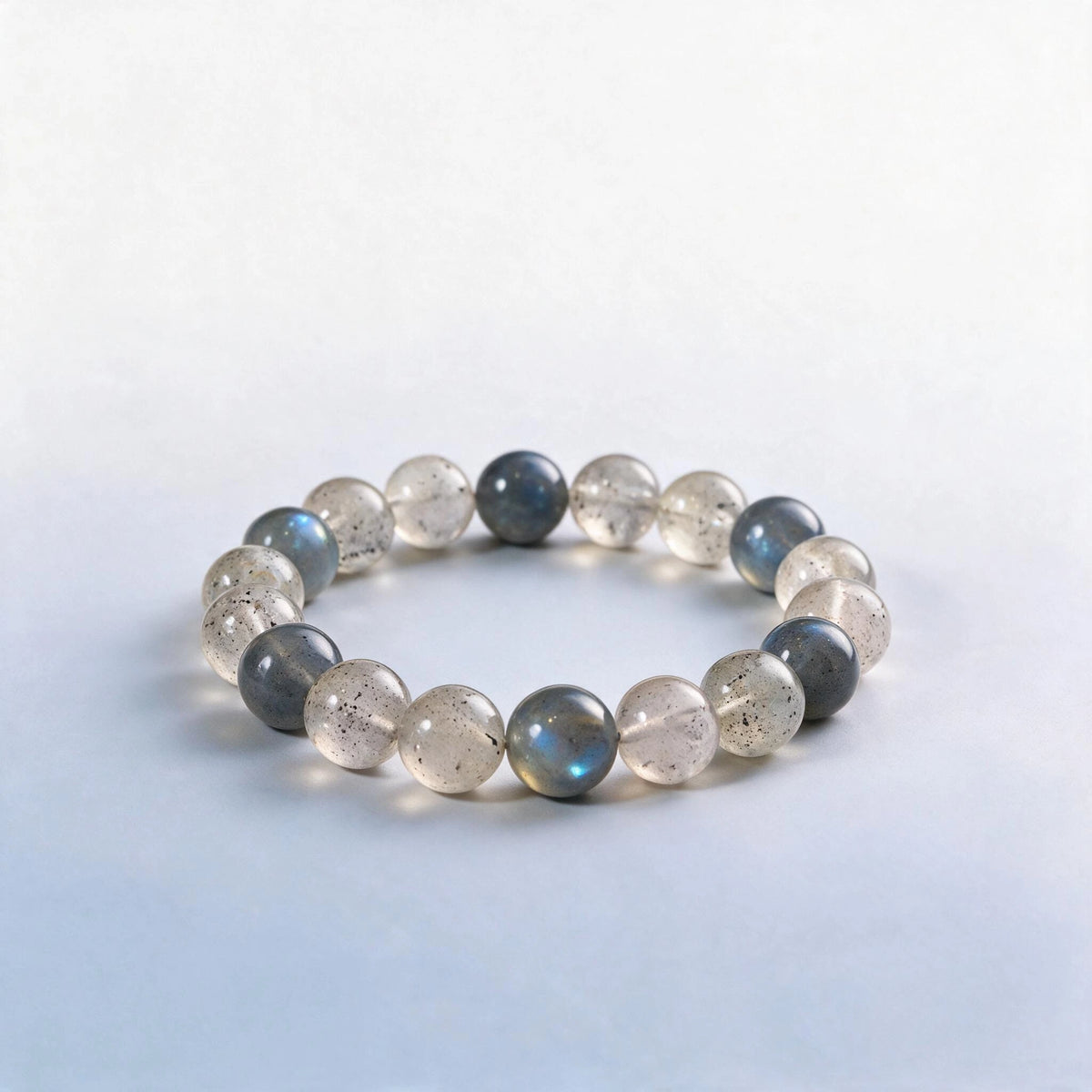Handcrafted Third Eye & Crown Chakra bracelet featuring natural labradorite and black strawberry quartz by Ember Quiet.