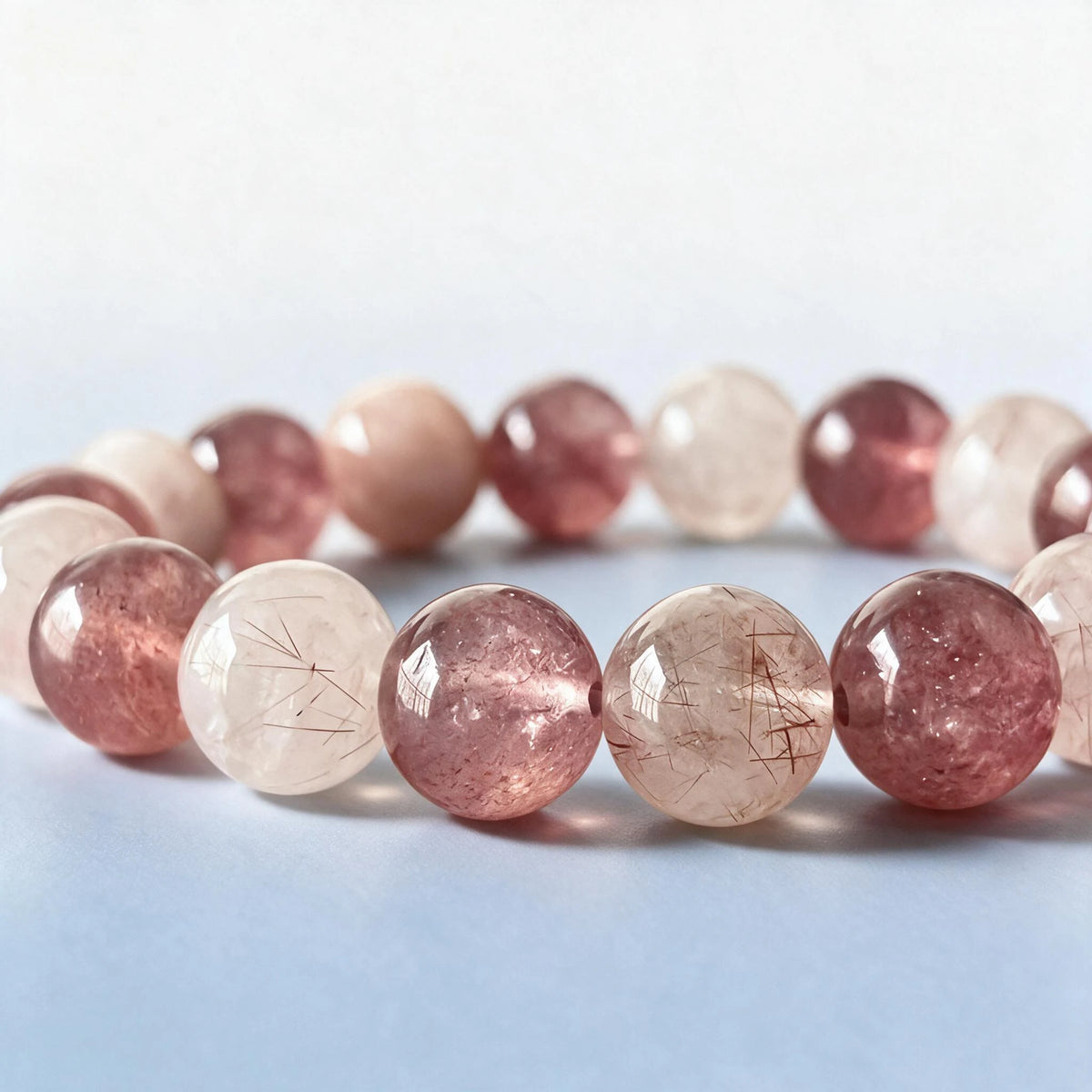 Macro close-up of authentic natural pink rutilated quartz needles and strawberry quartz inclusions by Ember Quiet.