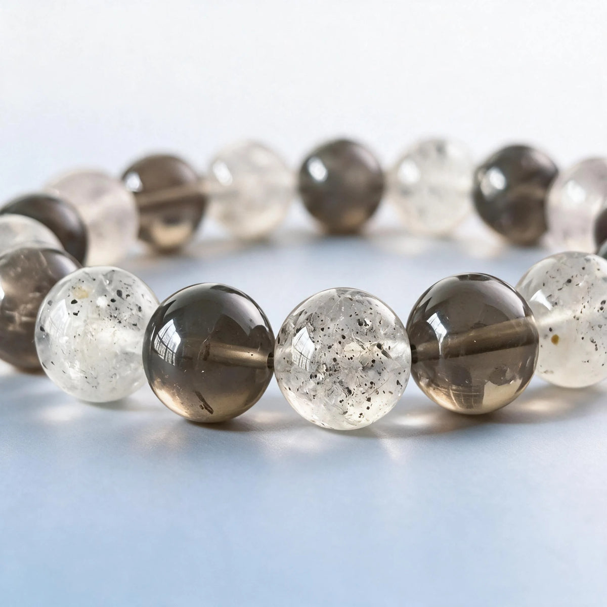 Macro close-up of authentic natural smoky quartz and black strawberry quartz mineral inclusions by Ember Quiet.