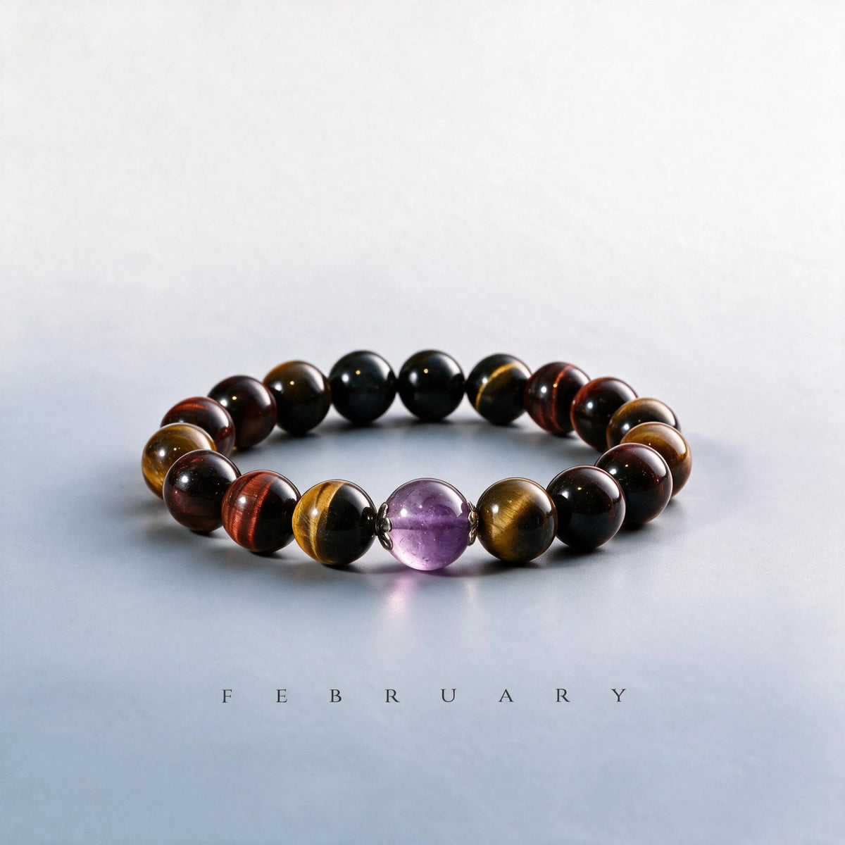 Custom February birth month Triple Tiger's Eye chakra bracelet featuring a center amethyst bead as a meaningful gift.
