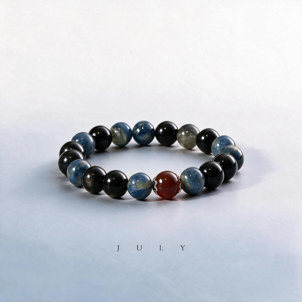 Custom July birth month Throat & Third Eye bracelet with blue kyanite, obsidian, and carnelian as a meaningful gift.